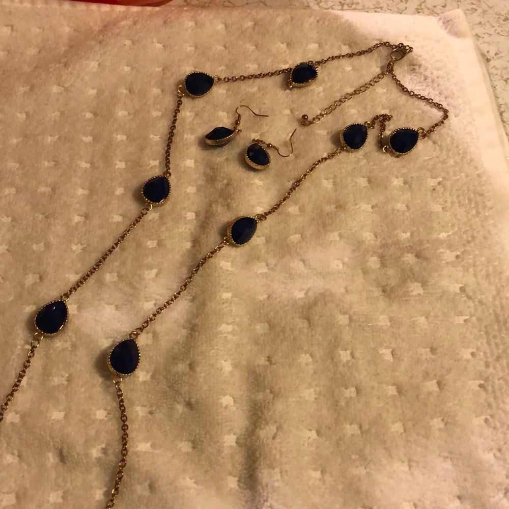 Dark blue necklace with oval shaped earrings